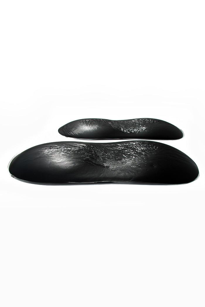 Side view of thickness of Hip and Butt Air-Infused Silicone Pads in black, for enhancing hips and butt shape.