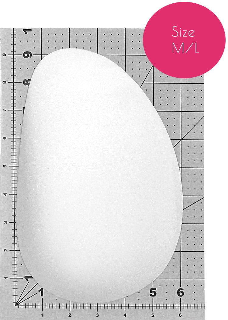 Butt pads - Foam, oblong shape in size M/L displayed on a size chart for reference.
