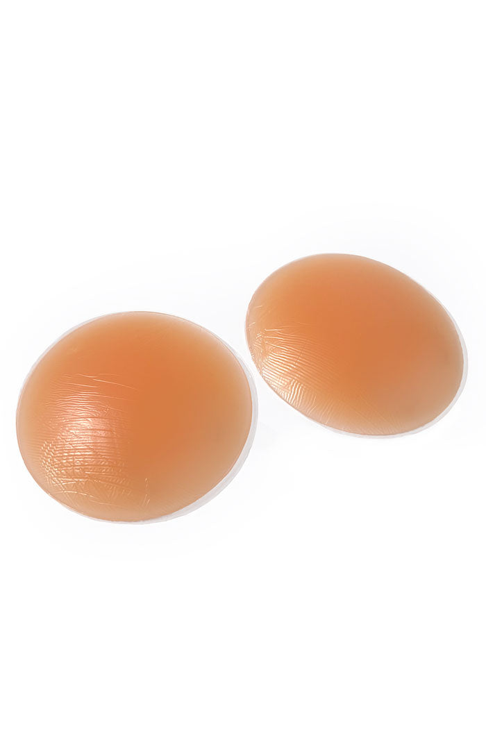 Silicone Butt Pads in traditional peach color, soft and realistic for body enhancement.