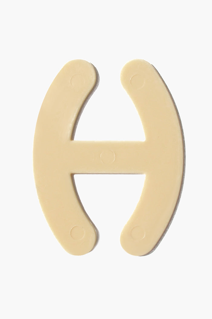 Bra Strap Adjuster plastic hook for bra strap management in beige.