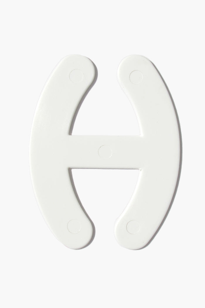 Bra Strap Adjuster plastic hook for managing bra straps in white.